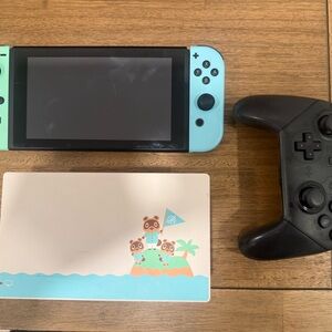 Nintendo Switch with Turquoise Pro Black Controller